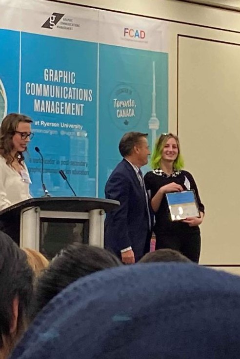 Accepting an award for maintaining my scholarship, which occured for each of the four years I studied